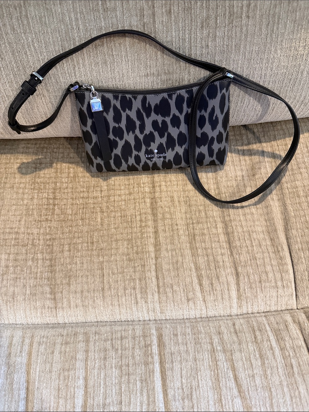 Kate Spade gray with black animal print Crossbody bag appr 8 by 5